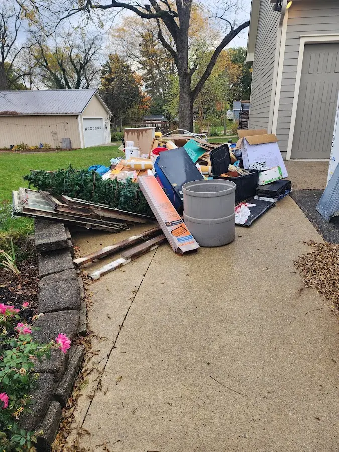 Dumpster being loaded with debris for Commercial Dumpster Rental in Wylie